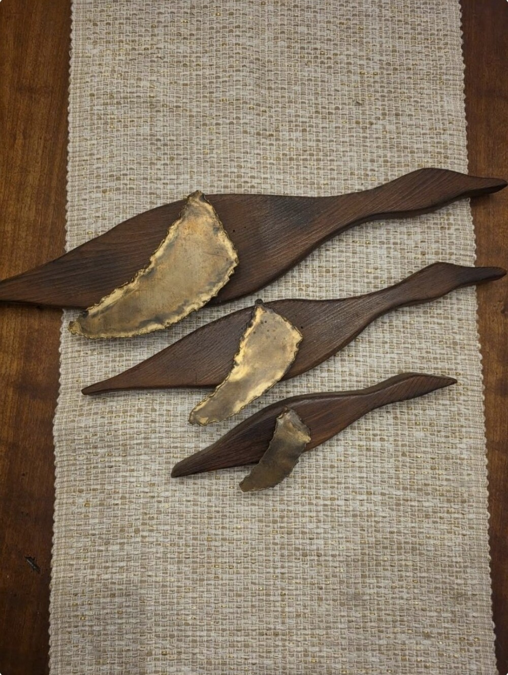 Three vintage mid-century modern, brass wing, wooden ducks wall hanging.
